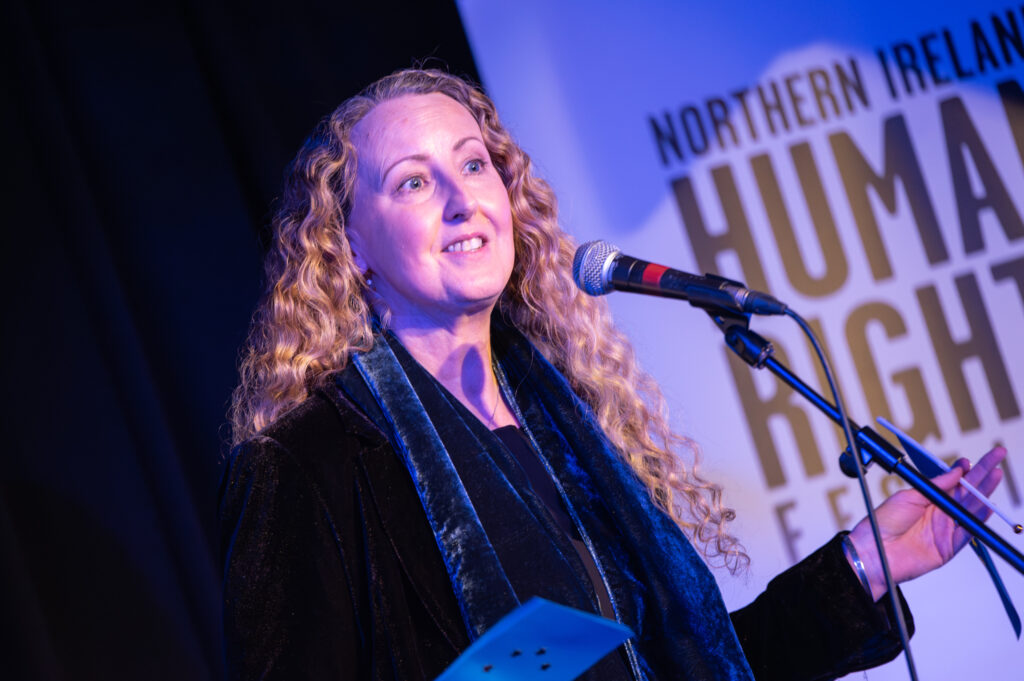 Rachel Hogan from the Children's Law Centre performing during the Stand Up for Your Rights Comedy Night